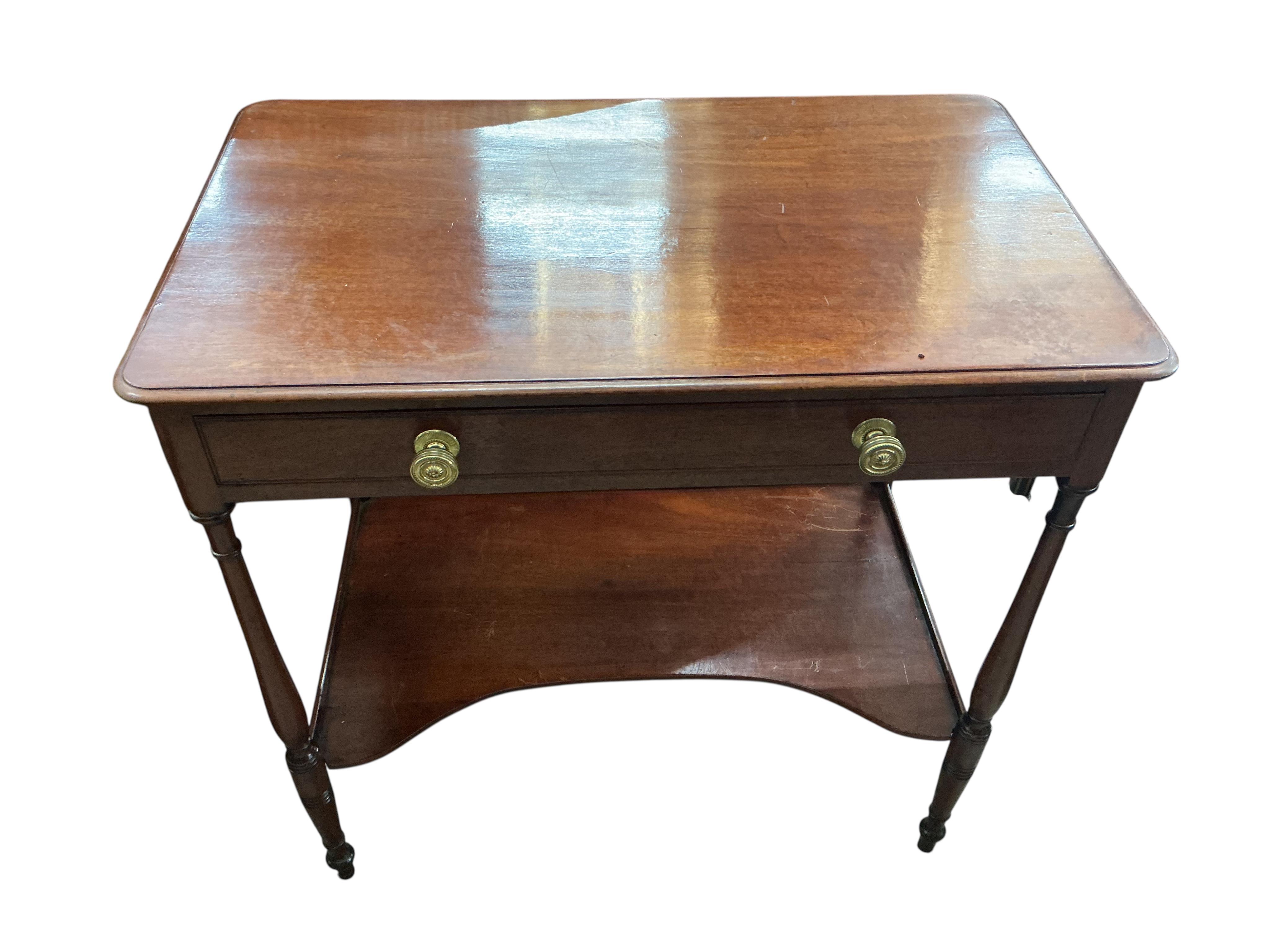 A small Victorian mahogany dressing table, with slender ring turned legs and undertier, width 74cm, depth 45cm, height 75cm
